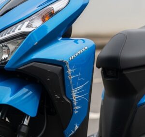 Honda click with deep scratches on its fairing